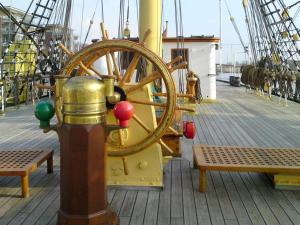 a wheel on the side of a boat at Schulschiff Deutschland Bremerhaven in Bremerhaven