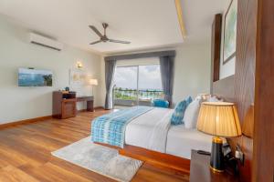 a bedroom with a bed and a large window at Sandy Bliss Mirissa in Mirissa +136 photos