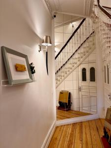 a hallway with a staircase and a stair case at Sleephotels Alsterroom in Hamburg +190 photos
