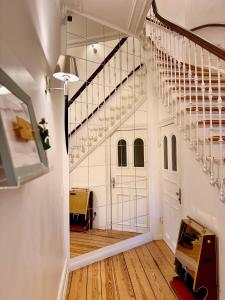 a staircase in a room with a stair case at Sleephotels Alsterroom in Hamburg