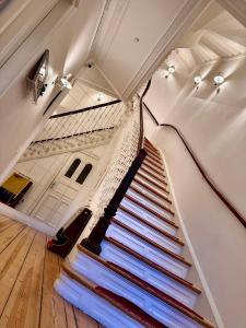 a staircase in a house with a stair case at Sleephotels Alsterroom in Hamburg