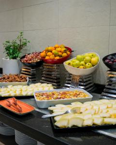 a table topped with lots of different types of food at Radisson Blu Hotel & Convention Center, Tunis in Tunis