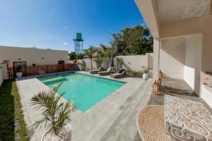 a swimming pool in the backyard of a house at Paris Royal Estate in Lusaka