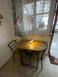 a table in a room with a window with a candle on it at U Sovičky in Olešník +12 photos
