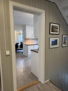 an open kitchen and dining room in a home at Spacious apartment in Follebu in Aulestad +37 photos