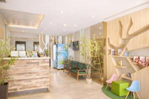a store with wooden walls and tables and chairs at A Hotel Joo Chiat in Singapore