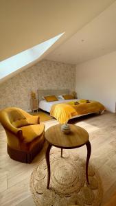 a large bedroom with two beds and a skylight at L'Echo du Bonheur in Vaumas +37 photos