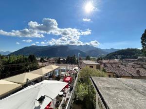 a view of a city with mountains in the background at Relax Home in Clusone