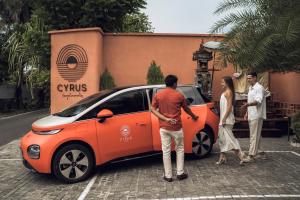 a group of people standing around a small car at Cyrus Villa Seminyak by Ini Vie Hospitality in Seminyak