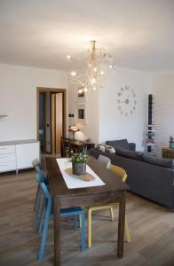 a living room with a dining table and a couch at La Casa di Emy in Solto Collina