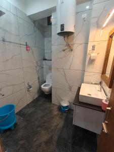 a bathroom with a sink and a toilet at Opal Villas Mussoorie near Mall Road in Mussoorie +114 photos