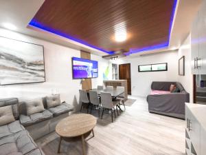a living room with a couch and a table at Davon- Doña Soledad in Polon