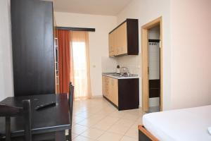 a kitchen with a sink and a counter top at Ksamil Harmony Studios in Ksamil