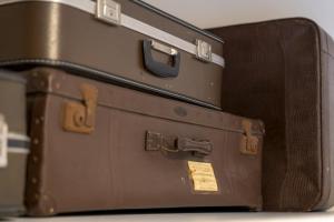 three suitcases stacked on top of each other at Hotel The Happy Traveler in Groningen