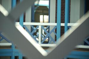 a close up of a staircase with blue railings at Villa d'Eaux in Villers-sur-Mer