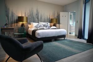 a bedroom with a bed and a chair at Villa d'Eaux in Villers-sur-Mer +92 photos