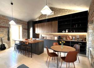 a kitchen with a table and chairs and a counter at The View in Motovun