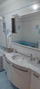 a bathroom with a sink and a mirror at apartma Kiana in Šempeter pri Gorici +43 photos