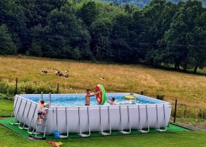 a group of children playing in a swimming pool at Zacisze w Karkonoszach in Karpacz