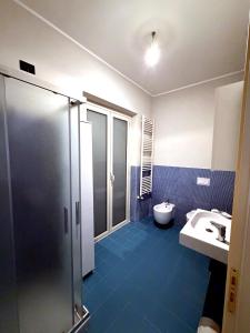 a bathroom with a shower and a sink and a toilet at Casa Decastadio in Melito di Porto Salvo