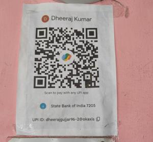 a sign on a wall that has a puzzle at Dheeraj Kumar Homestay in Phalauda