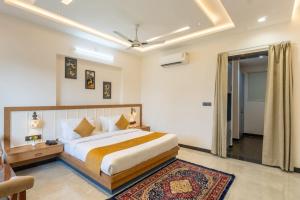 a bedroom with a large bed in a room at Milestone Resort in Thūr