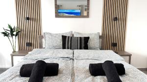 a bedroom with a bed with black towels on it at Chloraka Bay Studio in Khlorakas +18 photos