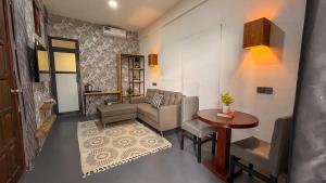 a living room with a couch and a table at The New Njiro Legacy in Arusha