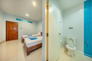 a bathroom with a bed and a toilet and a shower at Chaorua Hotel in Ko Phra Noi +41 photos