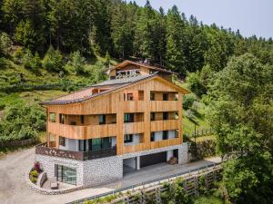 an overhead view of a house in the mountains at Chalet Esther in Longega