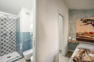 a bathroom with a toilet and a shower at La casa sulla Terrazza in Sarnico