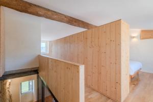 a staircase in a house with wood paneling at Flateli Cornellà del Terri in Santa Llogaia del Terri