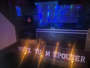 a view of a room with a sign that says vix reinforcer at Love Room La Crèche Romantique in Bogny Sur Meuse +63 photos
