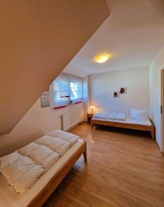 a bedroom with two beds in a room at Strandstr_ in Zingst