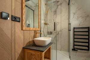 a bathroom with a sink and a shower at WHY NOT Myśliwska Exclusive Residence z basenem in Kościelisko +26 photos