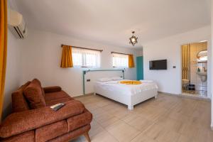 a bedroom with a bed and a couch at Ankakyaka Apart Hotel in Muğla +58 photos