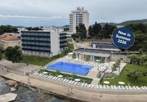 a view of the swimming pool at the new in sunshine apartments at Villas Arausana & Antonina in Vodice