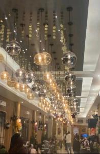 a large chandelier hanging from the ceiling in a store at Gulf Star Hotel Hargeisa in Hargeysa