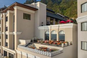 an aerial view of a hotel with tables and chairs at Bhangeri Durbar Resort in Nagarkot