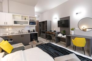 a living room with a bed and a kitchen at Breeze Apartments Megara - Linea in Megara