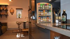 a kitchen with a counter and a refrigerator at Charming 1-Bed with Private Parking & Full Bath in Dunstable