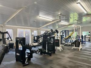 a gym with treadmills and machines in a room at Soluthera in Par