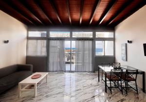 a living room with a couch and a table at Paradise in El Cotillo in El Cotillo