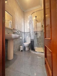 a bathroom with a shower and a toilet and a sink at Paradise in El Cotillo in El Cotillo +31 photos