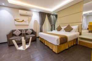 a hotel room with a bed and a chair at Al Muahidb Residence Al Takhasossi 4 - Economic in Riyadh +120 photos
