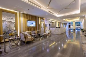 a lobby with a couch and chairs in a building at Al Muahidb Residence Al Takhasossi 4 - Economic in Riyadh