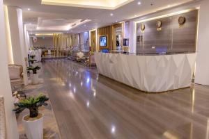 a lobby with a reception desk in a building at Al Muahidb Residence Al Takhasossi 4 - Economic in Riyadh