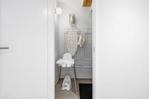a small bathroom with a shower and a sink at Metsa terraced house in Haapsalu +47 photos