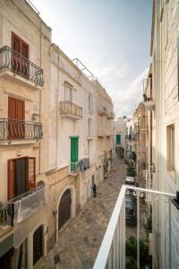 a view of an alley in an old town at Le Contrade Vico Alba in Monopoli