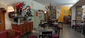 a dining room with tables and chairs in a restaurant at Montecarlo B&B in Tortona